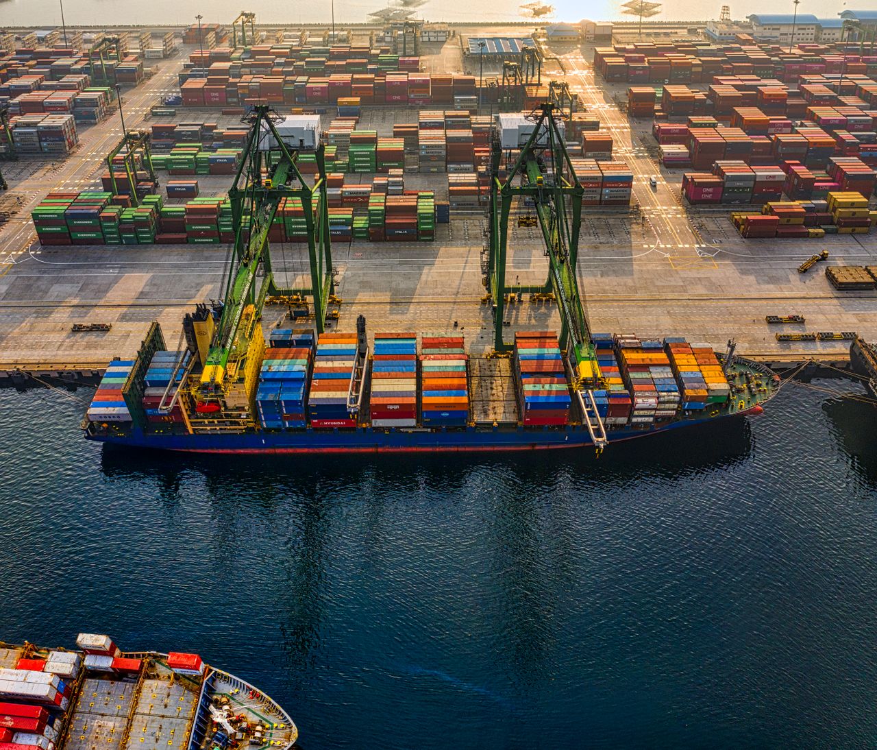 gallery-3 Aerial shot of colorful shipping containers at North Jakarta's bustling port, Indonesia.