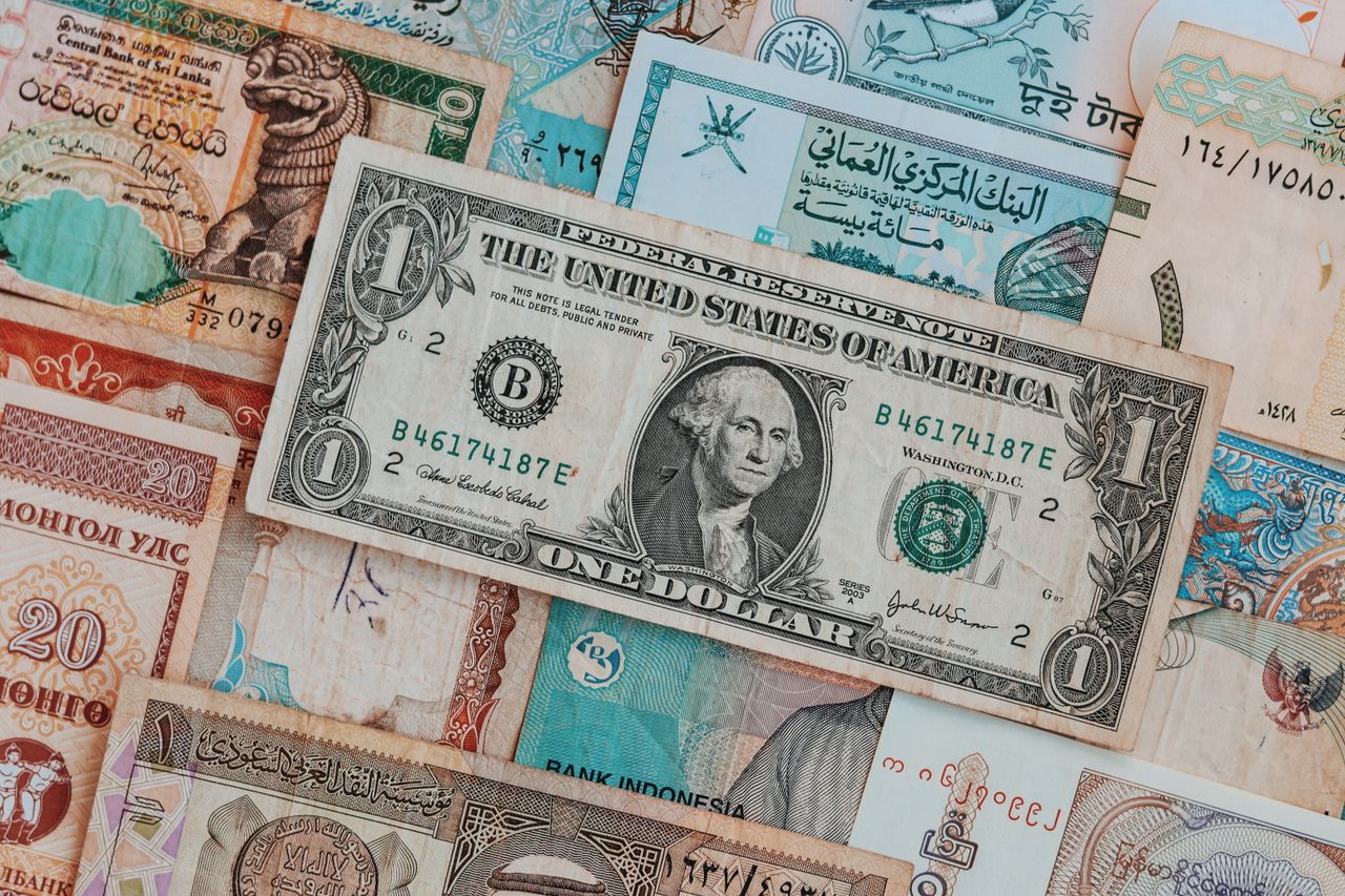 why-choose-us Top view of assorted paper money with American greenback representing image of President and numbers with words and signature on bill